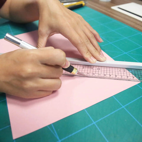 Using 45mm Rotary Cutter And Precision Knife Set For Art Quilting And Crafting With 12 Bonus Blades on pink paper