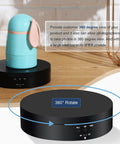 360 Rotating Display Stand Turntable Usb Powered Black Mirror Finish with a decorative blue bunny on top.