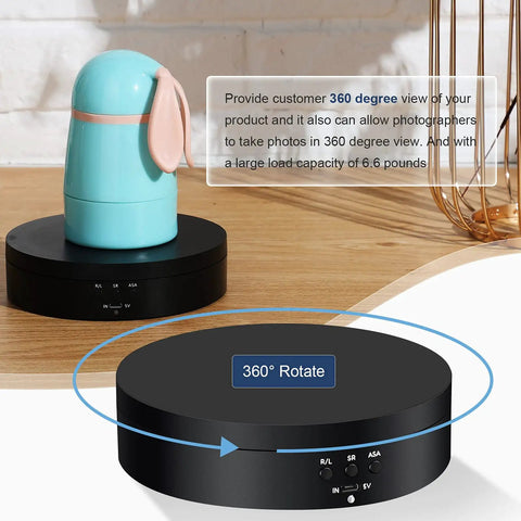 360 Rotating Display Stand Turntable Usb Powered Black Mirror Finish with a decorative blue bunny on top.