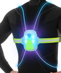 LED Reflective Running Vest With Front Light For Runners And Cyclists glowing on back of mannequin, high visibility fit.