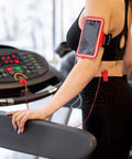 Person using treadmill with Two Pack Treadmill Magnetic Safety Keys Universal Round Emergency Stop Switch Replacement attached to clothing.
