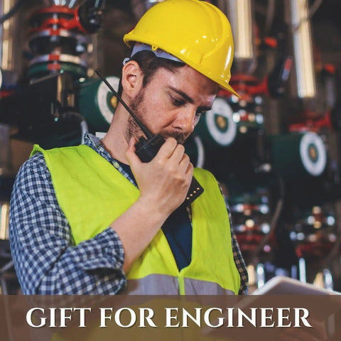 Engineer in yellow hard hat and vest using walkie-talkie, industrial background with text: Gift for Engineer