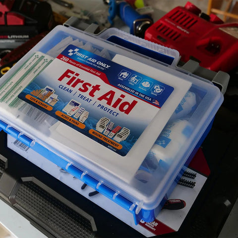 First aid kit in a blue translucent plastic case, 260-piece emergency kit.