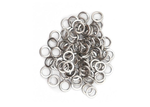 Top view of a pile of stainless steel spring lock washers (split washers) from an assortment kit