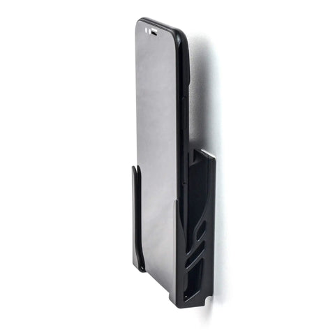 Legit Sturdy Black Smartphone Mount With Heavy Duty Screw Or Tape Options For Vehicles And Home Desk No Sweat Setup and Broad Compatibility For Daily Commutes And Office Use sitting next to a black smartphone.