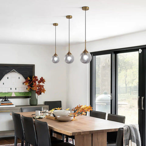 Dining room with smoked glass globe pendant light brushed gold finish for kitchen island and dining room dope modern mid century brass hanging fixture