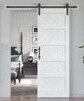 White 30x84 Inch Sliding Barn Door With 5.5 Ft Hardware Kit Included Solid MDF Slab With Waterproof Scratch Resistant PVC Surface DIY Easy Install Space Saving 5 Panel Door For Home And Apartment Renovations installed in a living room