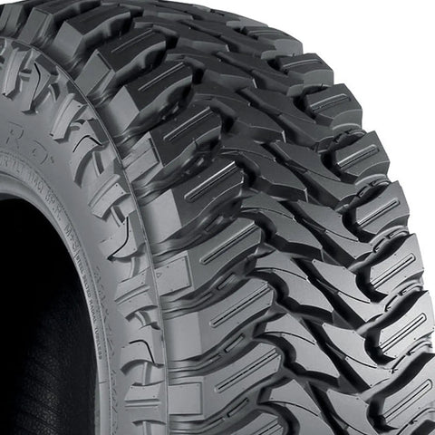 Close-up of Trail Blade MT Mud Terrain Tire LT285/75R16 E for Jeeps and light trucks, showcasing wraparound shoulder lugs.