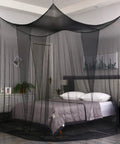 Black Bed Canopy With Mosquito Net For Full Queen And King Size Beds Indoor Or Outdoor Use Easy Access Four Openings All Around Protection From Insects Modern Gothic Halloween Decor Curtains For Bedroom Or Patio over a bed in a bedroom setting.