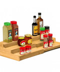 Premium Grade Three Tier Natural Bamboo Spice Rack With Adjustable Cabinet Organizer Shelf For No Sweat Kitchen Countertop Storage and Slick Rust Proof Home Setup displaying assorted spices and jars.