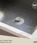 Dual Purpose Silicone Shower Drain Stopper And Hair Catcher Kills Sticky Pipe Buildup in sleek grey tone on stainless steel sink.