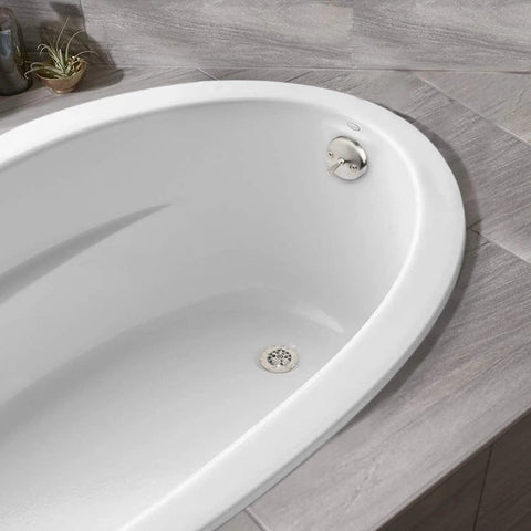 Slick Brushed Nickel Trip Lever Tub Drain Trim Kit Set With Overflow Face Plate Bathtub Drain Strainer And Screws Easy Swap DIY Install To Level Up Your Bathroom Setup Today, close-up of bathtub drain.