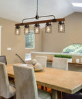 Five Light Modern Farmhouse Arched Kitchen Island Light 27 Inch Linear Chandelier With Seeded Glass Shades In Black Finish For Dining Room Or Pool Table ETL Listed Two Year Warranty Showroom Ready
