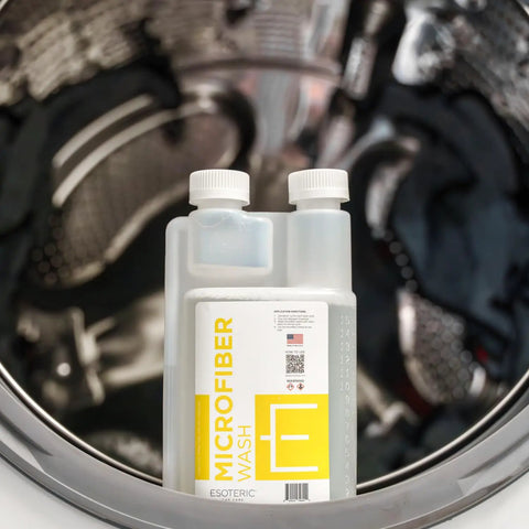 Ultra Premium Microfiber Towel Wash Detergent 16oz bottle in front of a washing machine drum