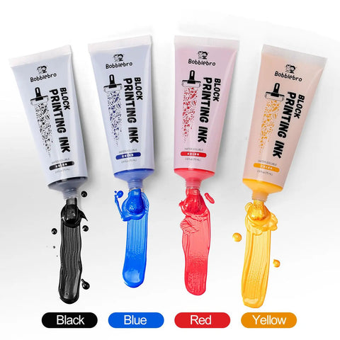 Linoleum Block Printmaking Kit With Four Color Ink showing black, blue, red, and yellow printing ink tubes with open nozzles.