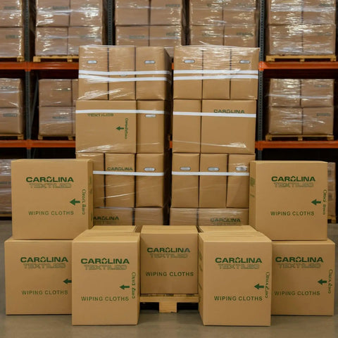 Bulk White Cotton Wiping Rags Made From Premium T Shirt Material Lint Free Cleaning Cloths boxes stacked in warehouse