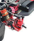 Close-up of Heavy Duty Metal Front And Rear Suspension Arm Steering Cup Hub Carrier Set For 10th Scale RC Cars Compatible With PTG2 Platform Rad Beefy Upgrade Kit In Bright Red.
