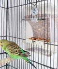 Zero Mess Parrot Automatic Feeder For Budgerigars And Canaries with screw fixed cage mount and seed dispenser in birdcage.