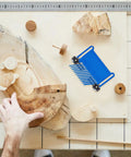 Heavy Duty Stackable Featherboard With Adjustable Miter Tracks And Dead Nuts Accurate Wood Holding Grip For Router Tables, blue, on workshop table.