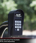 Wireless Weatherproof Gate Keypad FM137 mounted outdoors on post, showing numeric pad and protective cover, black