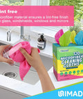 Person using a pink microfiber cloth from a 120 Pack Microfiber Cleaning Cloths For Cars And Home Use Reusable Towels 11x9 Multicolor With Crazy Handy Dispenser Box Scratch Free Lint Free Washable Rags For Detailing And Polishing to clean a glass jar in a kitchen sink.
