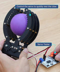 Person testing Heavy Duty Claw Gripper For DIY Projects with purple ball, full metal aluminum arm, servo not included.