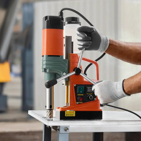 Hardcore 1450W Magnetic Core Drill 2 Inch Hole Capacity 2922 Pound Holding Force Variable Speed Copper Motor Pro Grade Machine For Steel Plates Includes Six Pilot Bits Total Slick Beast Setup with operator adjusting settings.