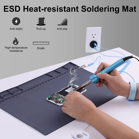 Grey anti-static ESD soldering mat on desk with wrist strap and grounding wire; 15.9 x 12 in, for electronics repair.