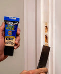 Using Plastic Wood All Purpose Latex Wood Filler Natural 3 Oz for quick interior and exterior wood fixes on door frame