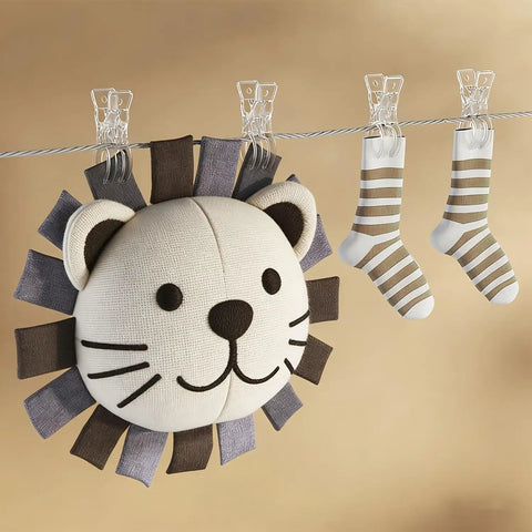 Premium Ten Pack Of Heavy Duty Spring Clips Measuring 3.5 Inches Featuring Transparent Plastic Build Solid Enough For Balloon Arch Displays And DIY Crafts With Zero Sweat Always The Go To Solution holding colorful socks above a lion plush toy.