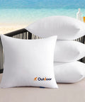 Outdoor Pillow Inserts Set Of 4 18x18 Waterproof Throw Cushions for patio and garden shown stacked on outdoor chair