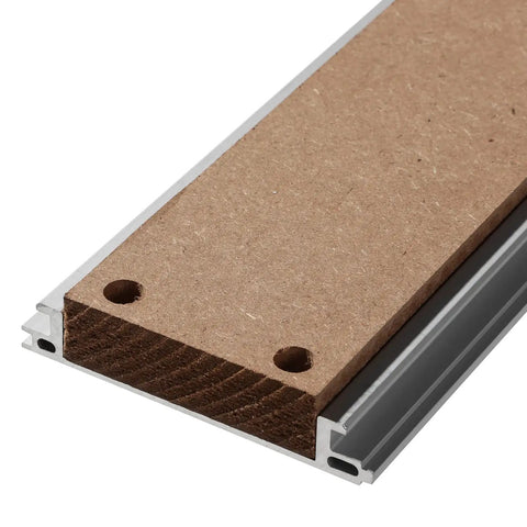 Close-up of Hybrid Aluminum And MDF Spoilboard Table edge showing T-track grid and replaceable MDF slat compatibility.