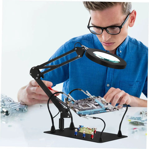Person using Six Piece Pro Grade Welding And Soldering Tool Flexible Arm Clamps With Built In Magnifying Lamp Base For Electronics Assembly Aid
