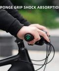 Close-up of hands using Premium Foam Lock On Bike Grips For Mountain Biking And More on a black handlebar for shock absorption.
