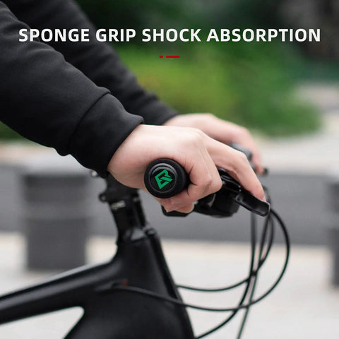 Close-up of hands using Premium Foam Lock On Bike Grips For Mountain Biking And More on a black handlebar for shock absorption.