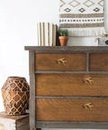Antler Inspired Resin Cabinet Knobs Set Of 6 With Deer Horn Design installed on wooden dresser in country kitchen decor