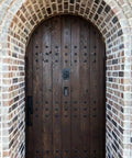 Rustic wooden door with Premium One And A Half Inch Clavos Nails With Matte Black Powder Coat Finish Built To Last Outdoor Tough As Nails Zinc Alloy Head 40 Pack Ideal For Outdoor Builds detailing.