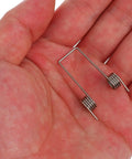 Cool 36 Piece Torsion Spring Assortment Kit Fix Your Flip Top Trash Cans With 9 Sizes For Easy Home Repair Woodworking And DIY Hacks To Get That Snappy Closure., silver metal torsion spring in hand