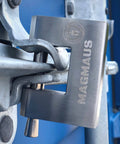 Close-up of Armored High Security Padlock For Outdoor Storage Units Sheds Gates And Garages Weatherproof Heavy Duty Lock on blue door
