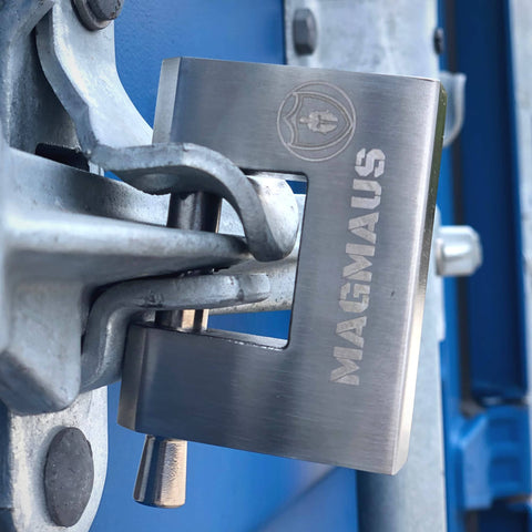 Close-up of Armored High Security Padlock For Outdoor Storage Units Sheds Gates And Garages Weatherproof Heavy Duty Lock on blue door