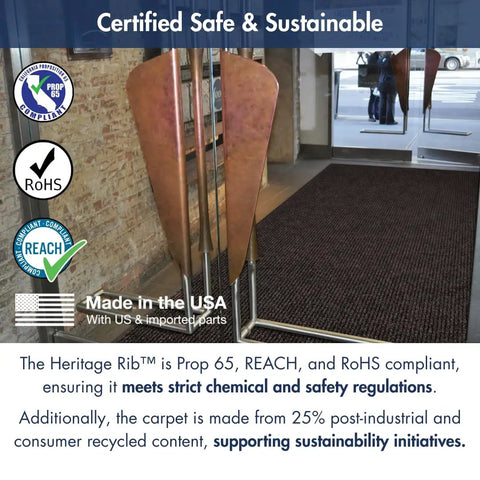 Heritage Rib Commercial Indoor Door Mat With Double Rib Design 3x5 Charcoal Office Rug in a lobby, near glass doors, highlights non slip feature.