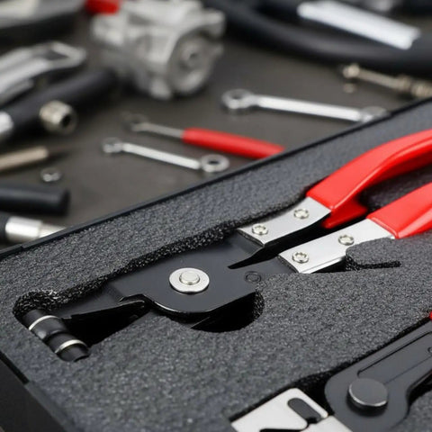 Heavy Duty Hose Clamp Pliers Set With Storage Case Made From Alloy Steel For Auto Repair Shops And Home Garages Featuring Four Custom Tools close-up in foam case