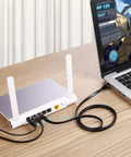 Cat8 Ethernet Cable 5 Ft Flat 5 Pack Multi Color High Speed 40Gbps 2000MHz RJ45 Patch Cord connecting laptop to router