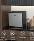 Sick Silver Mini Freezer With 1.1 Cu Ft Storage Capacity Featuring Reversible Door on modern kitchen counter.