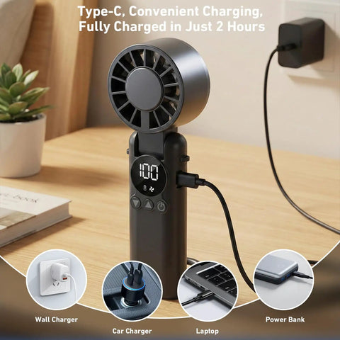 Portable Handheld USB Fan With 5000mAh Rechargeable Battery LED Display Foldable Design on desk charging