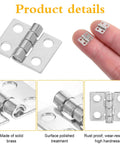 100 Pcs Tiny Silver Hinges For Crafts 10x8mm Mini Hinges For Jewelry Boxes And Wooden Miniature Furniture shown on fingers and close-up views.