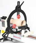 Wood lathe steady rest with black arch and red adjustment wheels, supporting a wooden spindle blank.