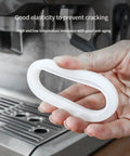51mm Silicone Steam Ring Replacement for Espresso Machines held near Delonghi EC680 coffee maker