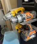 Magnetic Power Tool Organizer Wall Mount Rack with Cordless Drill Storage in Garage, holding two heavy-duty drills.