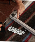 Premium Heavy Duty Barn Door Slider Track Wheel Kit With Smooth Silent Rolling Bearings during installation with tools.